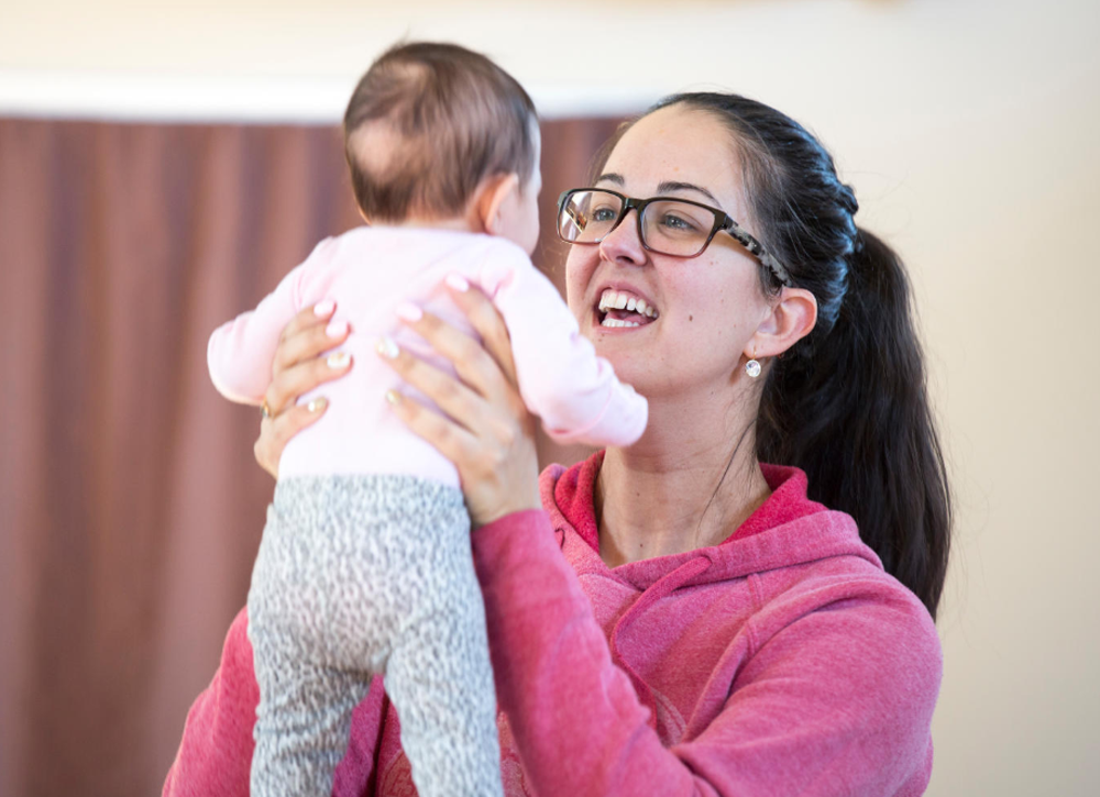 Child care worker with an infant