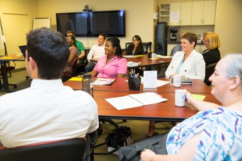 group of adults in a meeting room