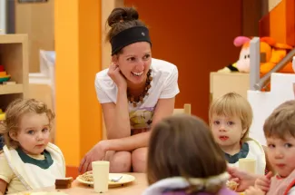 Child care worker with children